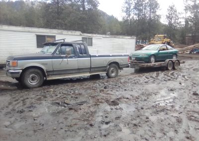 Dead or Alive Auto Recycling Ltd | Towing a car on our trailer