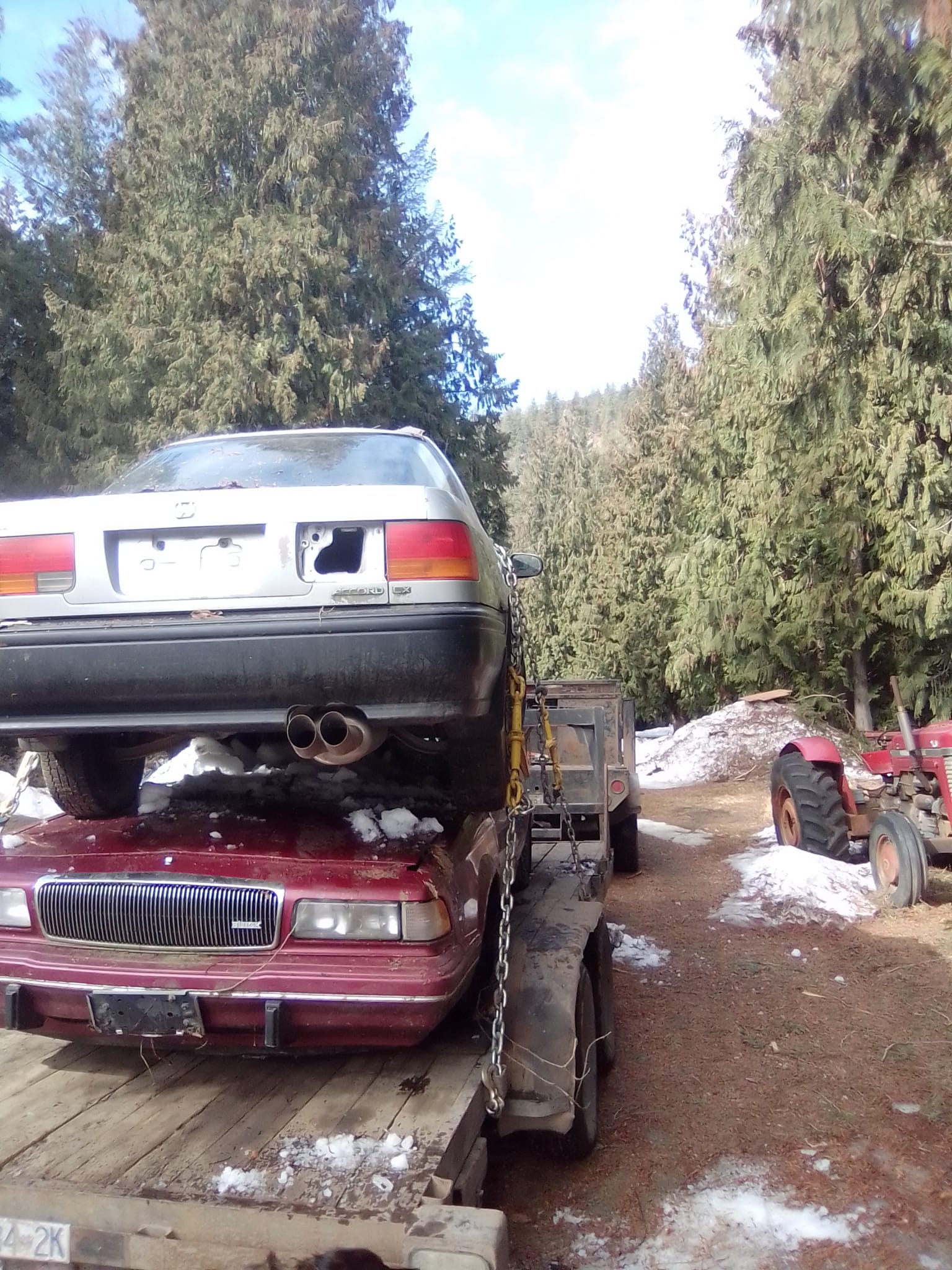 Dead or Alive Auto Recycling Ltd | Towing cars on our flatbed